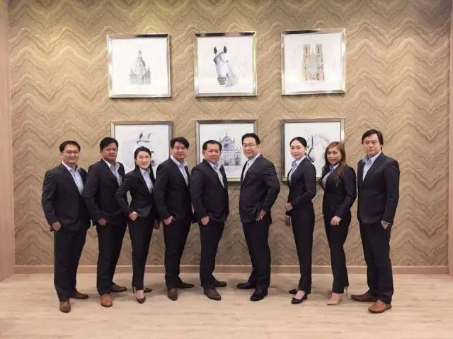 The Loft team standing together in navy suits