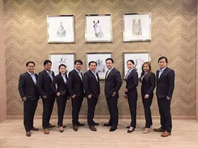 The Loft team standing together in navy suits