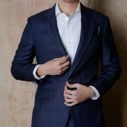 A navy windowpane check jacket worn over a white shirt